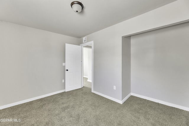 unfurnished bedroom with carpet floors and baseboards