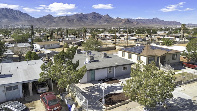 drone / aerial view featuring a residential view and a mountain view