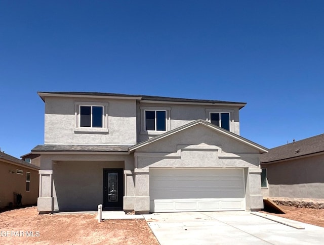 10705 Walden Pond St, El Paso, TX 79924 - view of front of property with stucco siding, driveway, and a garage