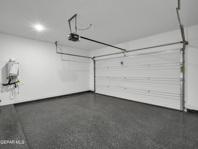 garage with baseboards and a garage door opener