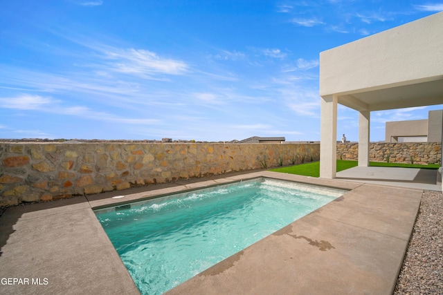 view of swimming pool with a patio and a fenced backyard
