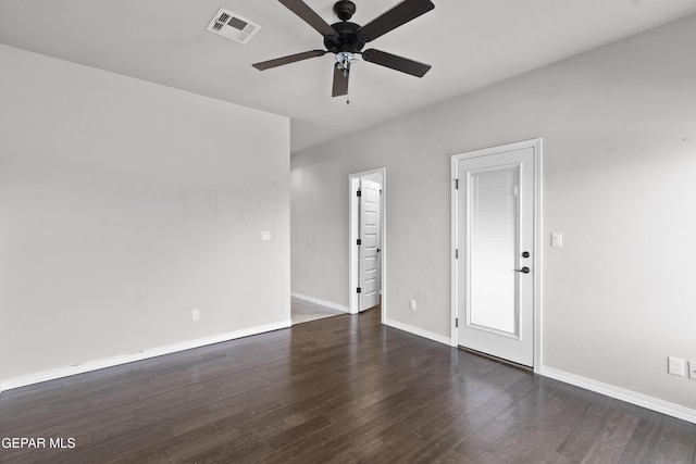 empty room with visible vents, ceiling fan, baseboards, and wood finished floors