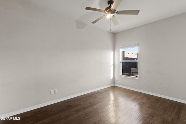 unfurnished room with a ceiling fan, baseboards, and wood finished floors