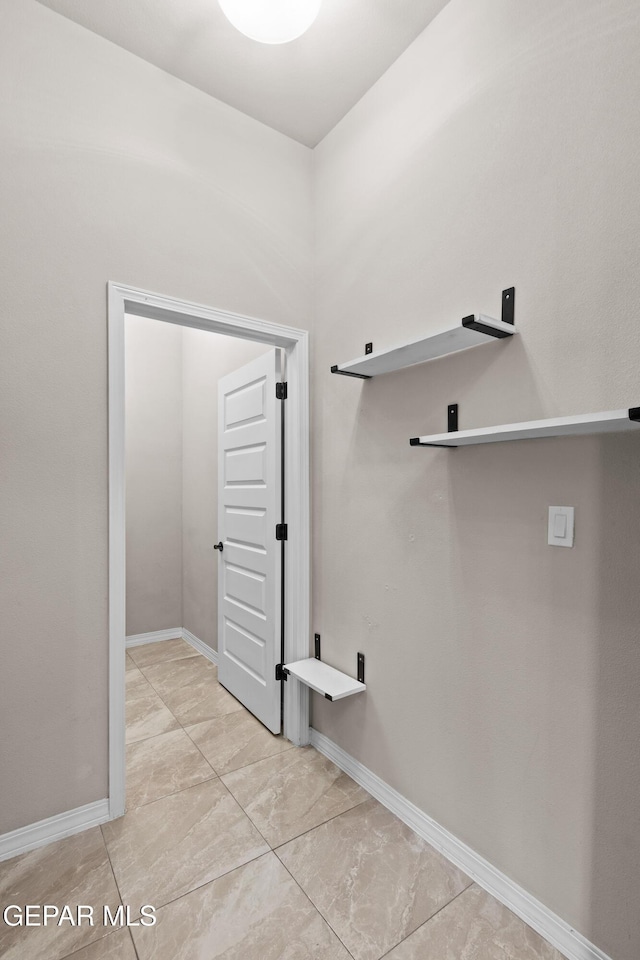 laundry room featuring laundry area and baseboards