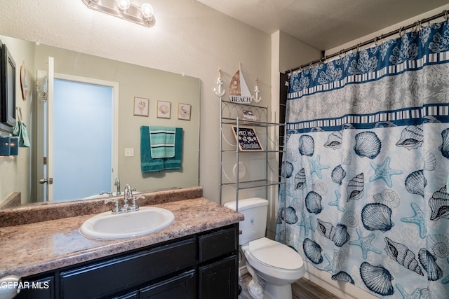 bathroom with toilet, a textured ceiling, vanity, and a shower with curtain