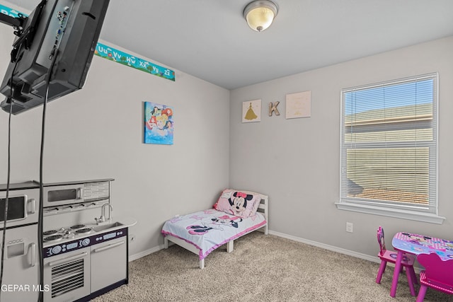 carpeted bedroom with baseboards