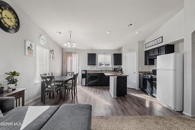 dining area featuring baseboards, dark wood finished floors, visible vents, and a notable chandelier