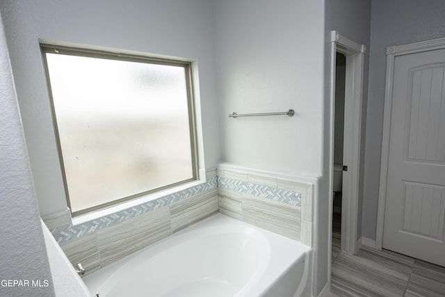 bathroom featuring a garden tub