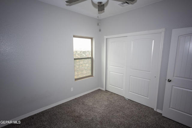 unfurnished bedroom featuring a closet, visible vents, a ceiling fan, carpet flooring, and baseboards