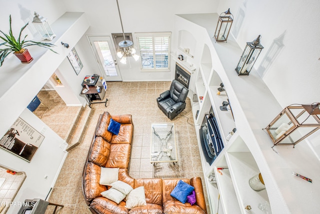 living area featuring tile patterned flooring and baseboards