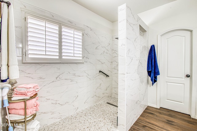 full bathroom featuring wood finished floors and walk in shower