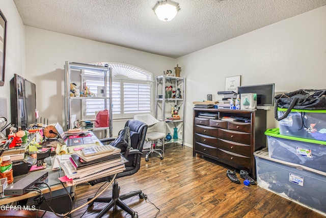 office space featuring hardwood / wood-style flooring and a textured ceiling