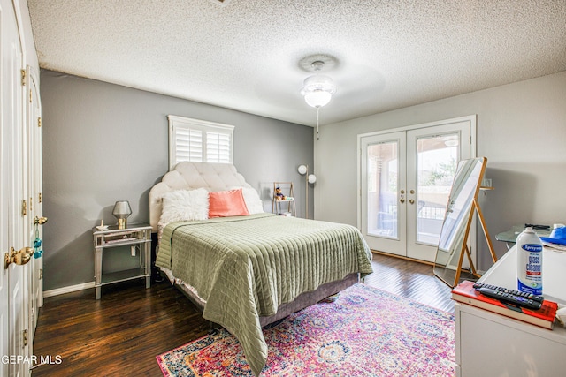 bedroom featuring access to exterior, french doors, ceiling fan, a textured ceiling, and wood finished floors