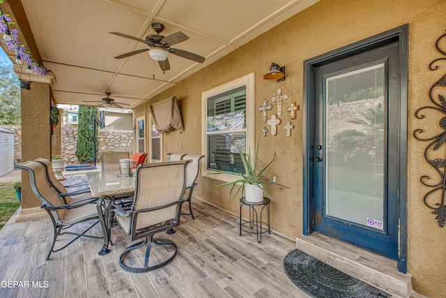 view of patio featuring outdoor dining area and ceiling fan