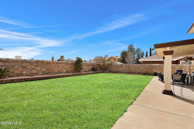 view of yard featuring a patio and fence