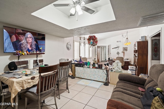 dining room featuring visible vents, ceiling fan, a textured ceiling, and light tile patterned floors