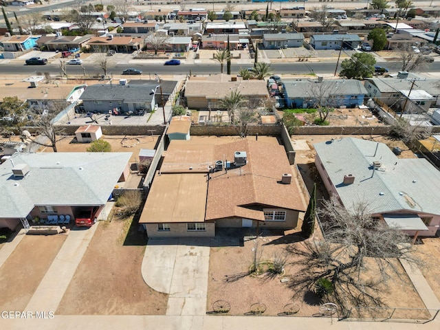 birds eye view of property with a residential view