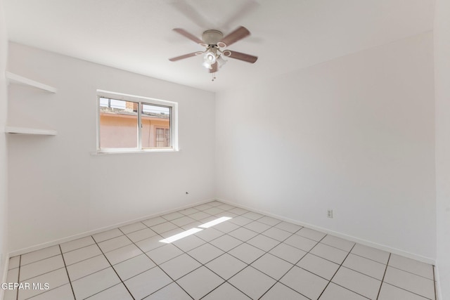 unfurnished room with baseboards and a ceiling fan