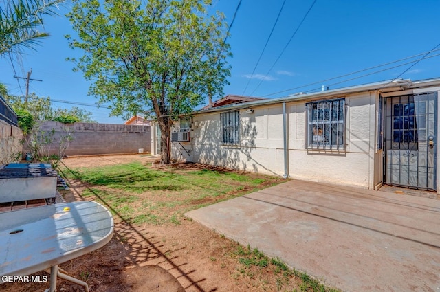 exterior space featuring cooling unit, fence private yard, and a patio