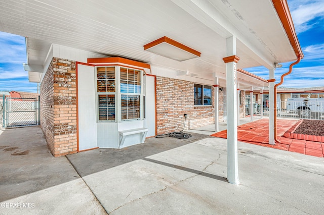 view of patio featuring a gate and fence