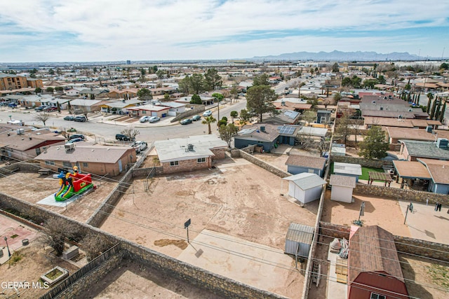 birds eye view of property with a residential view and a mountain view