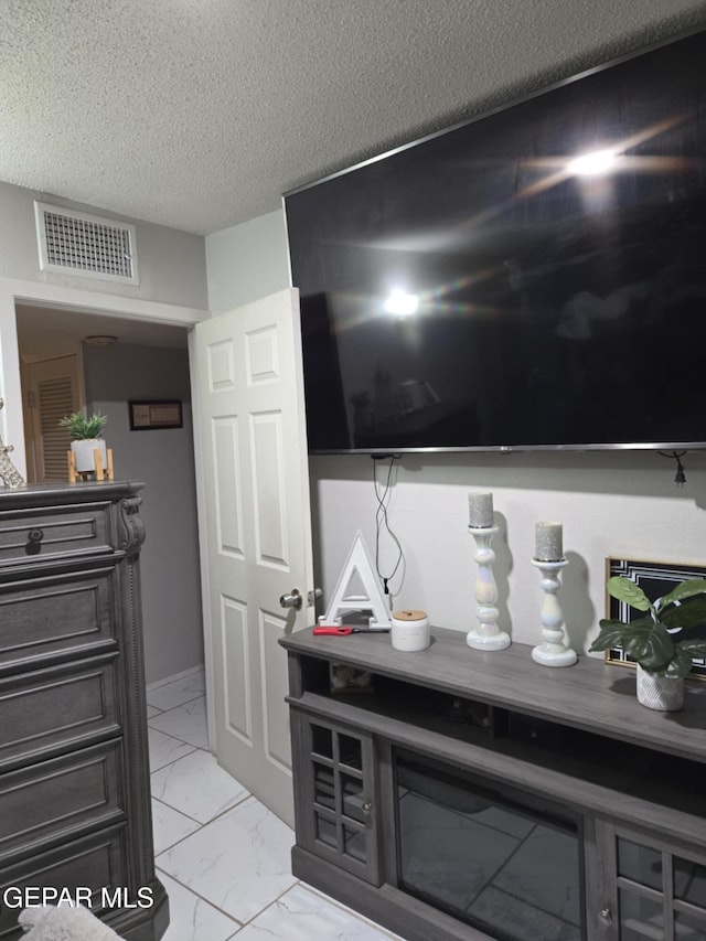 interior details with visible vents and a textured ceiling