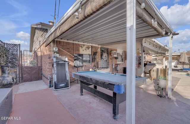 view of patio / terrace featuring a jacuzzi