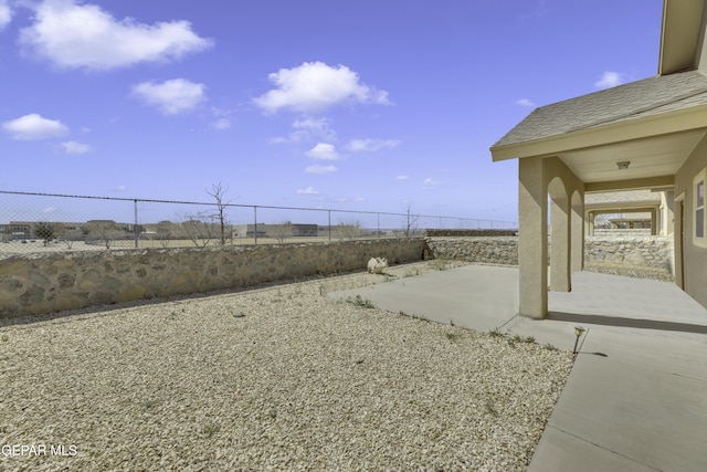 view of yard featuring a patio and a fenced backyard