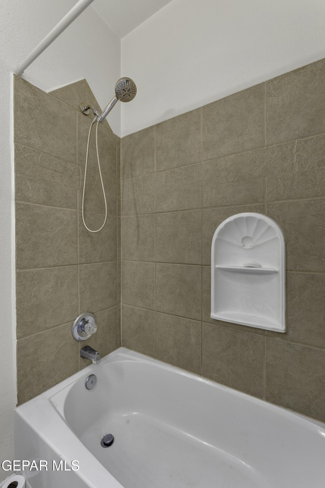 bathroom featuring  shower combination