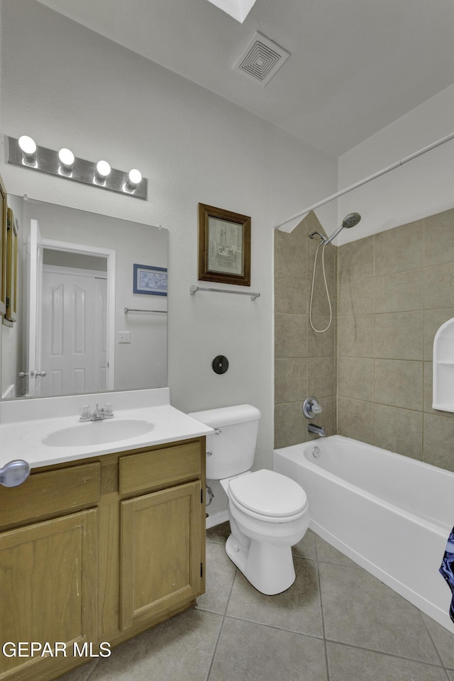 full bathroom with visible vents, toilet, tile patterned flooring, shower / bath combination, and vanity