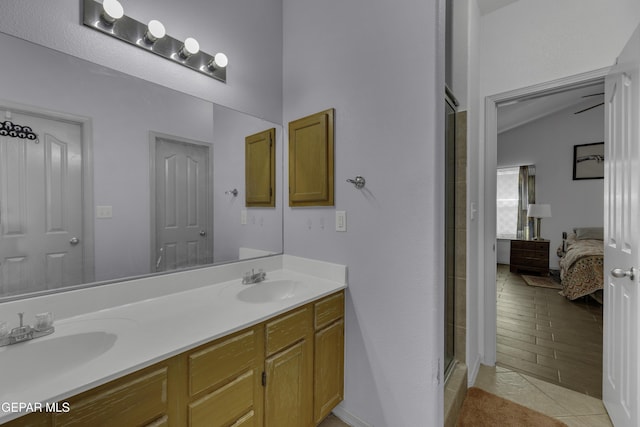 full bathroom with a sink, double vanity, a stall shower, and connected bathroom