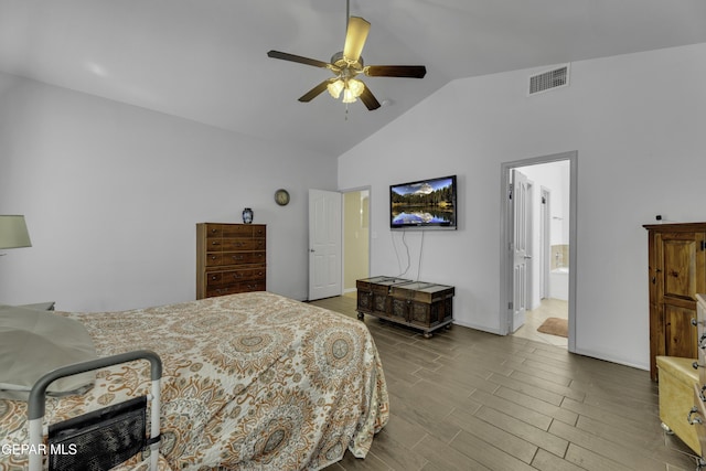 bedroom featuring vaulted ceiling, wood finished floors, visible vents, and ceiling fan