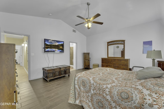 bedroom with visible vents, wood finished floors, baseboards, ceiling fan, and vaulted ceiling