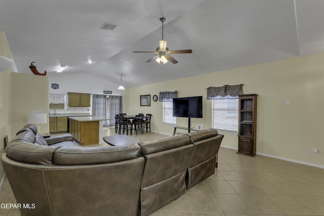 living room with visible vents, light tile patterned flooring, baseboards, ceiling fan, and vaulted ceiling