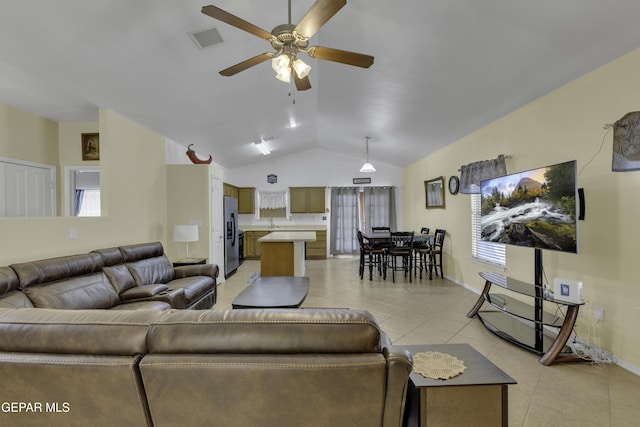 living area with baseboards, visible vents, light tile patterned flooring, ceiling fan, and vaulted ceiling