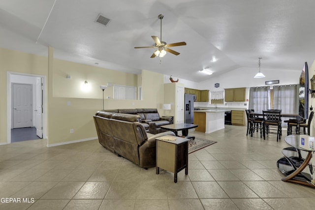 living room with light tile patterned floors, visible vents, lofted ceiling, and a ceiling fan