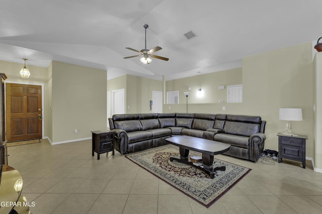 living room with light tile patterned floors, visible vents, lofted ceiling, and baseboards