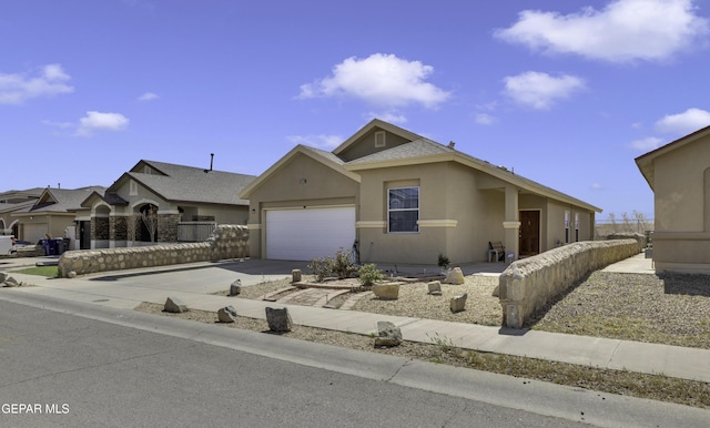 ranch-style home featuring stucco siding, an attached garage, and driveway