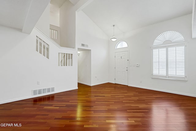 foyer with visible vents, high vaulted ceiling, baseboards, and wood finished floors