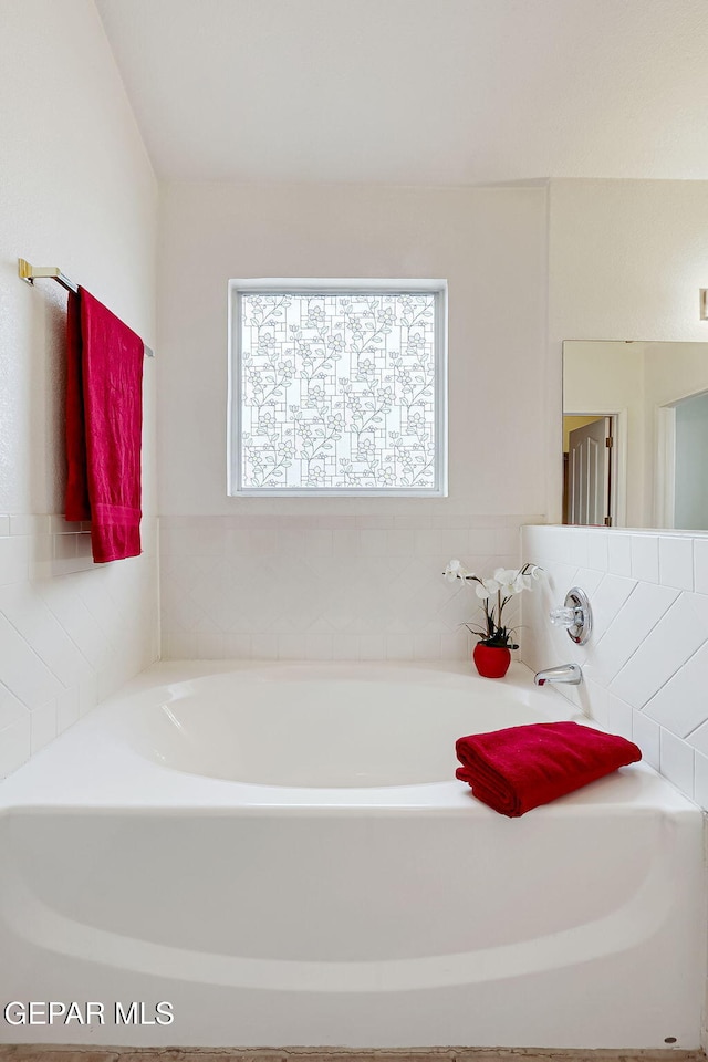 full bath featuring a garden tub