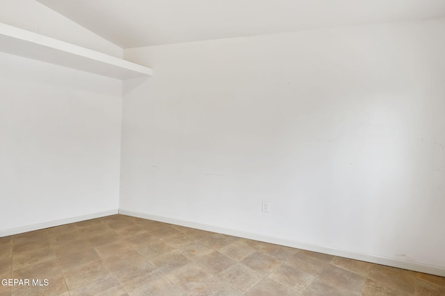 unfurnished room with baseboards