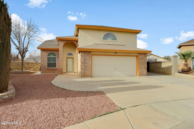 view of front of house with concrete driveway, brick siding, a garage, and roof with shingles