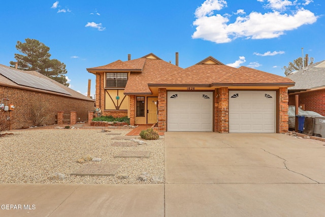 view of front of house featuring a garage, brick siding, concrete driveway, and a shingled roof