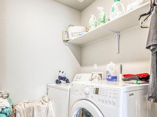 laundry area featuring laundry area and washing machine and clothes dryer