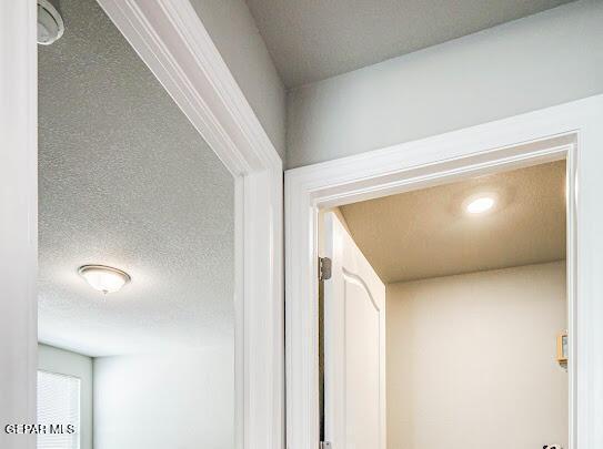 interior details with a textured ceiling