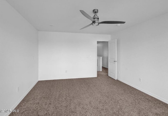 empty room with carpet, baseboards, and ceiling fan