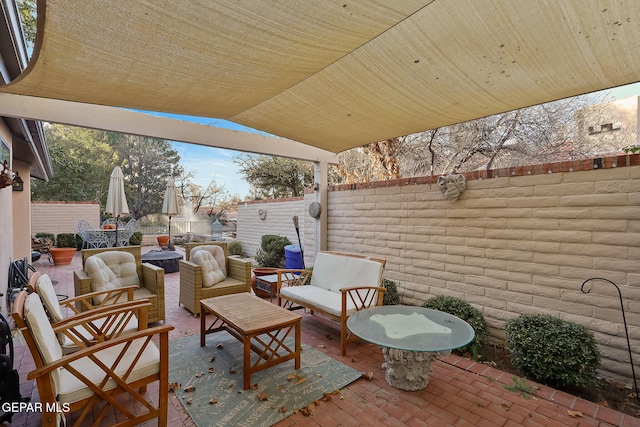 view of patio / terrace with an outdoor hangout area and a fenced backyard