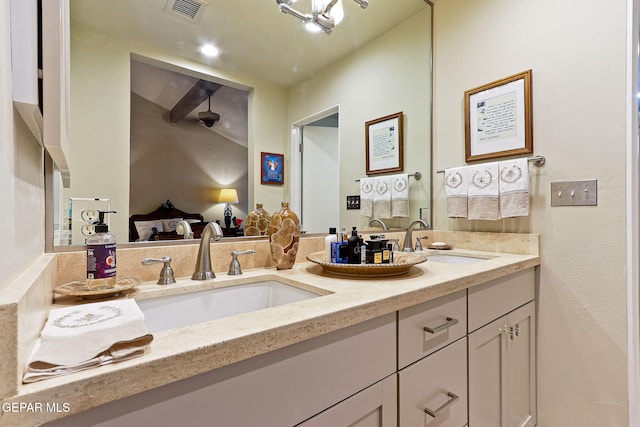 full bath with double vanity, a sink, visible vents, and a ceiling fan