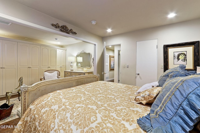 bedroom featuring recessed lighting and visible vents