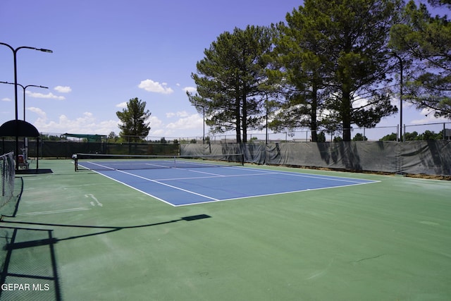 view of sport court with community basketball court and fence